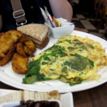 Blue Mushroom Omelet: eggs with onions, mushrooms, spinach, and cheese, with side of potatoes and toast